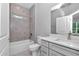 Well-lit bathroom with a tub, stylish vanity, and modern fixtures, creating a serene and functional space at 9405 Se 159Th Ln, Summerfield, FL 34491
