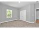 Neutral bedroom with carpet, a window providing natural light, and a double door closet at 9405 Se 159Th Ln, Summerfield, FL 34491