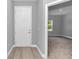 Entryway with a view into a bright bedroom with a large window at 9405 Se 159Th Ln, Summerfield, FL 34491