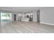 Bright, open living area flows seamlessly into the kitchen with stainless appliances and lots of natural light at 9405 Se 159Th Ln, Summerfield, FL 34491