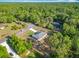 Aerial view of the home nestled among lush greenery in a serene setting at 9525 Sw 200 Ct, Dunnellon, FL 34431