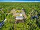 Beautiful single-Gathering home surrounded by lots of lush green trees from above at 9525 Sw 200 Ct, Dunnellon, FL 34431