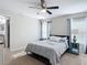 A bedroom features natural light, a ceiling fan, a window and a comforting bed at 9525 Sw 200 Ct, Dunnellon, FL 34431