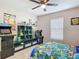 Bright bedroom featuring a cartoon-themed decor and game arcade for relaxation and entertaining at 9525 Sw 200 Ct, Dunnellon, FL 34431