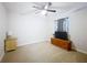Minimal bedroom featuring carpet floors, dresser and window with curtains for comfortable living at 9525 Sw 200 Ct, Dunnellon, FL 34431