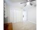 Bright bedroom featuring a ceiling fan, carpeted floor and a closet with sliding doors at 9525 Sw 200 Ct, Dunnellon, FL 34431