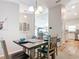 An inviting dining area features stylish decor, lighting, and seamless flow into the adjacent kitchen at 9525 Sw 200 Ct, Dunnellon, FL 34431