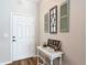 Stylish entryway featuring decorative shutters, a charming table, and elegant decor elements at 9525 Sw 200 Ct, Dunnellon, FL 34431