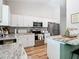 An open-concept kitchen features modern appliances, ample counter space, and stylish finishes at 9525 Sw 200 Ct, Dunnellon, FL 34431