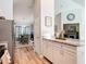 A kitchen offers bar seating and opens to a dining area and living room space at 9525 Sw 200 Ct, Dunnellon, FL 34431