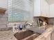 A kitchen sink with granite countertop and stainless steel faucet at 9525 Sw 200 Ct, Dunnellon, FL 34431