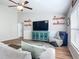 Cozy living room with a television and shelves, perfect for relaxing and entertaining guests at 9525 Sw 200 Ct, Dunnellon, FL 34431
