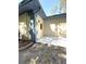 The back patio features a door, providing outdoor entertainment space or a place for relaxation at 9711 Sw 196Th Cir, Dunnellon, FL 34432