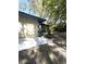 The back of the home shows a screened in porch and outdoor space for enjoying the scenery at 9711 Sw 196Th Cir, Dunnellon, FL 34432