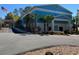 Community building with an American flag and well maintained surroundings at 9711 Sw 196Th Cir, Dunnellon, FL 34432