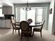 Cozy dining area with bay window provides lots of natural light and comfortable seating at 9711 Sw 196Th Cir, Dunnellon, FL 34432