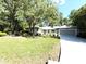 Charming single-story home with a well-manicured lawn and mature trees at 9711 Sw 196Th Cir, Dunnellon, FL 34432