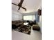 Cozy living room with large window and comfortable seating arrangement at 9711 Sw 196Th Cir, Dunnellon, FL 34432
