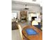 Open floor plan dining area, and the living room features a fireplace at 9711 Sw 196Th Cir, Dunnellon, FL 34432