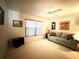 Bright living room featuring a sofa, neutral color scheme and natural light at 9711 Sw 196Th Cir, Dunnellon, FL 34432