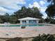 Community pool and clubhouse offer a refreshing outdoor space for relaxation and socializing at 9711 Sw 196Th Cir, Dunnellon, FL 34432