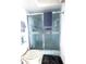 Shower features glass doors, blue trim, neutral wall, and towel rack at 9711 Sw 196Th Cir, Dunnellon, FL 34432