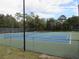 Well-maintained community tennis courts with lighting offer residents a place to engage in friendly competition at 9711 Sw 196Th Cir, Dunnellon, FL 34432