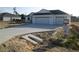 Charming single-story home featuring a spacious three-car garage and a concrete driveway at 10409 Sw 45 St, Ocala, FL 34481