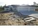 Beautiful single-story home featuring a three-car garage and concrete driveway at 10409 Sw 45 St, Ocala, FL 34481