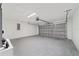 This garage features concrete floors and motorized garage door at 10426 Sw 133Rd Ave, Dunnellon, FL 34434
