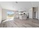 Well-lit kitchen features a center island with a breakfast bar, stainless steel appliances, and easy access to the dining area at 10426 Sw 133Rd Ave, Dunnellon, FL 34434
