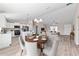 Bright dining area and kitchen with stainless steel appliances and a view into the living room, creating an inviting space at 10426 Sw 133Rd Ave, Dunnellon, FL 34434