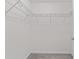 Empty walk-in closet that shows storage and organization with installed shelving to maximize functionality and organization at 10426 Sw 133Rd Ave, Dunnellon, FL 34434