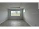 Bright bedroom with window and neutral walls and tile flooring at 10530 Sw 98Th Pl, Ocala, FL 34481