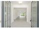 Inviting foyer with bright lighting and an open view into the home's spacious and modern living area at 10530 Sw 98Th Pl, Ocala, FL 34481