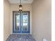 Elegant double front doors featuring decorative glass panels and a welcoming entrance to this charming home at 10530 Sw 98Th Pl, Ocala, FL 34481