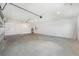 Spacious three-car garage with bright lighting and water heater for added convenience at 10530 Sw 98Th Pl, Ocala, FL 34481