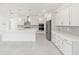 Spacious kitchen featuring an island, stainless steel appliances and shaker style cabinets at 10530 Sw 98Th Pl, Ocala, FL 34481