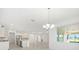 Bright kitchen and dining area featuring large island, stainless steel appliances and sliding glass doors at 10530 Sw 98Th Pl, Ocala, FL 34481