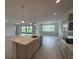 Kitchen with a large island, stainless steel appliances, and scenic outdoor views at 10530 Sw 98Th Pl, Ocala, FL 34481