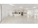 Open-concept kitchen featuring a large island, stainless steel appliances and tile floors at 10530 Sw 98Th Pl, Ocala, FL 34481