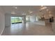 Open-concept living space features lots of natural light, tile flooring, and modern finishes at 10530 Sw 98Th Pl, Ocala, FL 34481