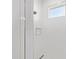 Walk-in shower featuring white tile walls, built-in niche, and rainfall shower head at 10530 Sw 98Th Pl, Ocala, FL 34481