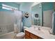 Charming full bathroom with floral decor, vanity, and shower-tub combo at 12165 Se 91St Ave, Summerfield, FL 34491