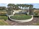 Well-maintained landscaping and signage welcomes visitors to the Del Webb's Spruce Creek Country Club at 12165 Se 91St Ave, Summerfield, FL 34491