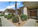Inviting front entrance with manicured landscaping, a palm tree, and a well-lit walkway at 12165 Se 91St Ave, Summerfield, FL 34491