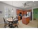 Eat-in kitchen with stainless appliances, center island, and natural light creating an inviting cooking space at 12165 Se 91St Ave, Summerfield, FL 34491