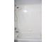 Close-up of a bathtub with white tile surround and shower fixtures in a bathroom at 13816 Sw 112Th Ter, Dunnellon, FL 34432