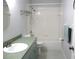 Well-lit bathroom featuring a vanity, toilet, and a clean bathtub with white tile surround at 13816 Sw 112Th Ter, Dunnellon, FL 34432