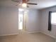 Neutral bedroom showcasing plush carpet, ceiling fan and ample natural light at 13816 Sw 112Th Ter, Dunnellon, FL 34432